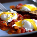 Savor Shakshuka: Poached Eggs Meet Spiced Tomato Delight